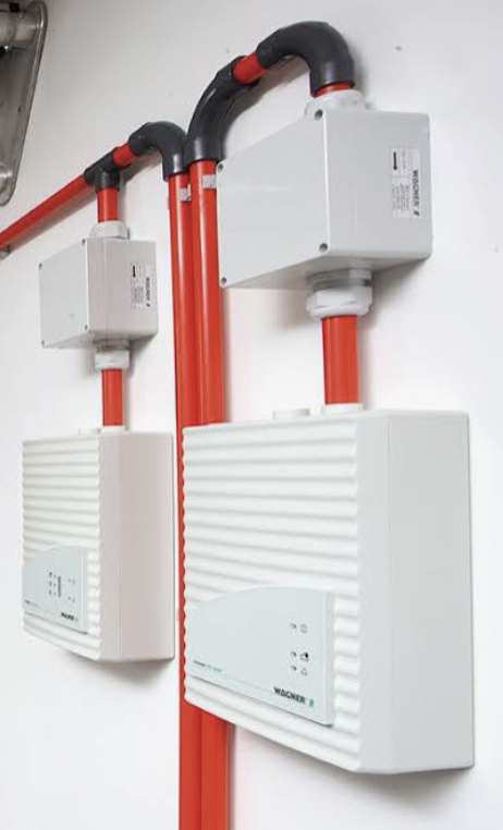 Wagner aspirating smoke detector units connected to red sampling pipes